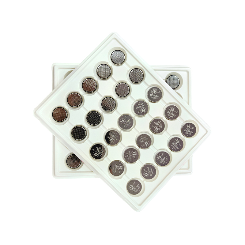 How does the internal structure of a button cell achieve high energy density?